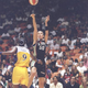 Rebecca Lobo shoots over Lisa Leslie at the inaugural game. (Getty)